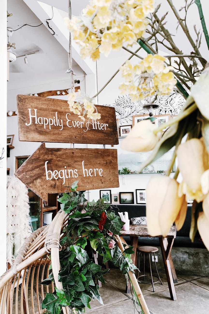 Elegant interior with wooden signage and floral decor, perfect for joyful occasions.