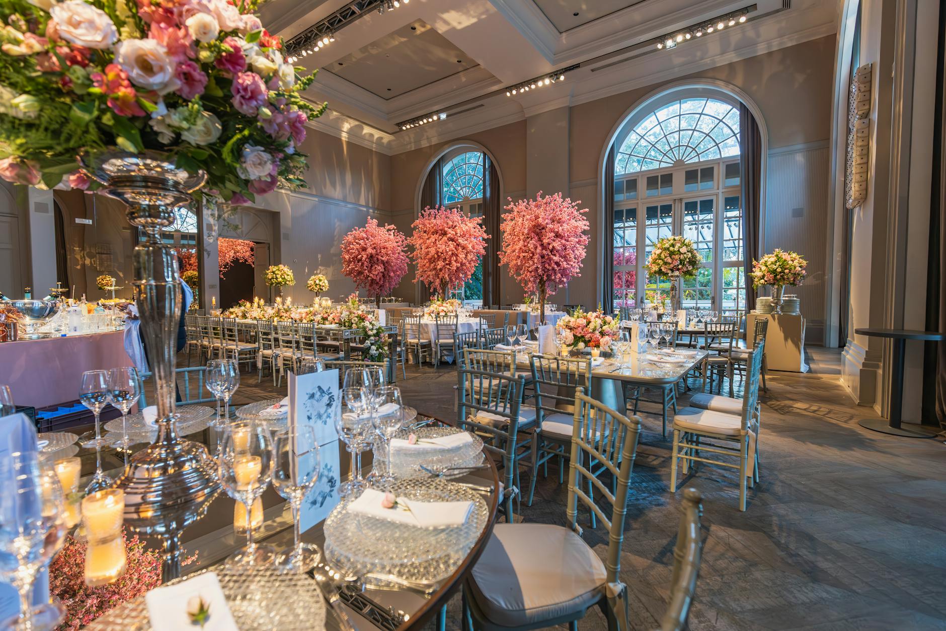 Lavish wedding venue decorated with colorful flowers and elegant table settings, perfect for a grand celebration.